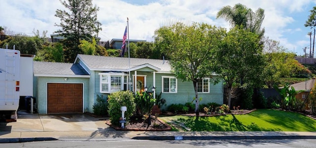 view of front facade with a garage and a front lawn