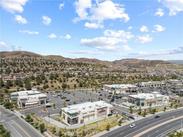 birds eye view of property with a mountain view