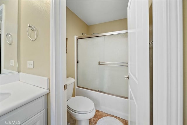 full bath with vanity, toilet, tile patterned flooring, and enclosed tub / shower combo