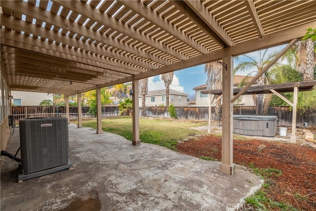 view of patio with cooling unit, a hot tub, and a pergola