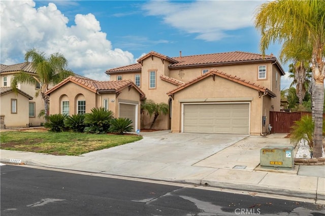 mediterranean / spanish home featuring a front lawn