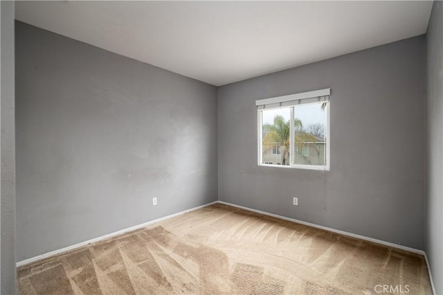 empty room featuring carpet flooring