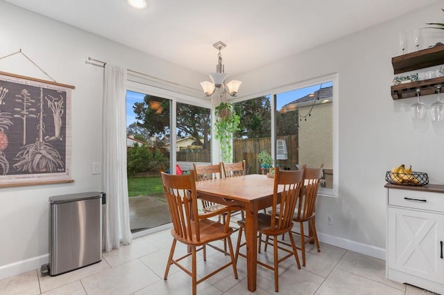 tiled dining area featuring a notable chandelier