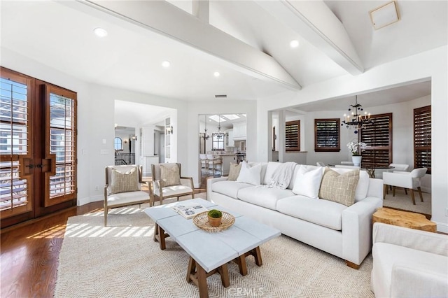 212 John St, Manhattan Beach, CA 90266 - living area featuring recessed lighting, a chandelier, wood finished floors, vaulted ceiling with beams, and baseboards