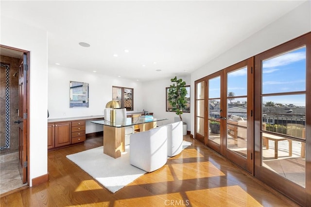 212 John St, Manhattan Beach, CA 90266 - home office featuring french doors, baseboards, recessed lighting, and wood finished floors