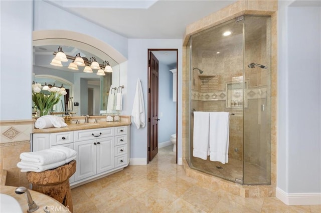 212 John St, Manhattan Beach, CA 90266 - full bath featuring toilet, vanity, baseboards, and a stall shower