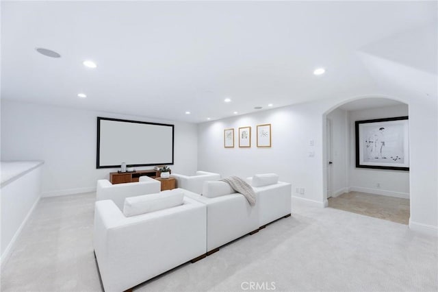 212 John St, Manhattan Beach, CA 90266 - cinema featuring arched walkways, light colored carpet, baseboards, and recessed lighting