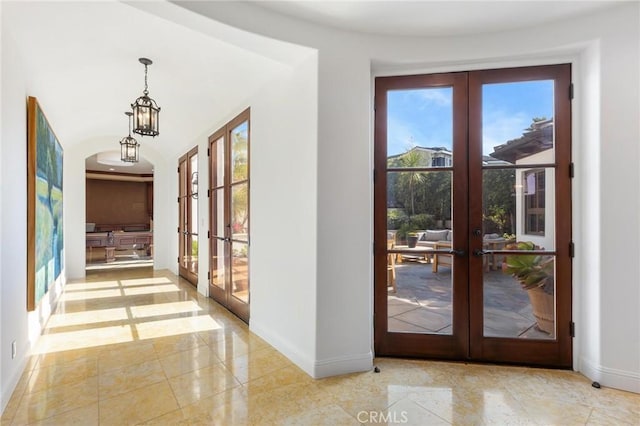 212 John St, Manhattan Beach, CA 90266 - doorway to outside featuring french doors, baseboards, and arched walkways