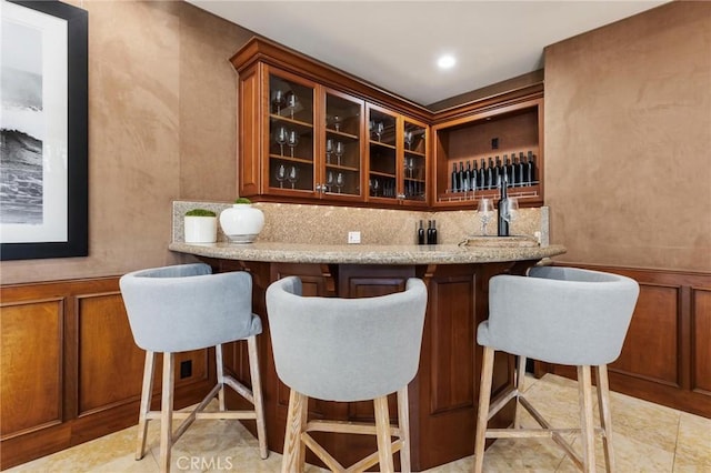 212 John St, Manhattan Beach, CA 90266 - bar with indoor wet bar, a decorative wall, recessed lighting, wainscoting, and backsplash