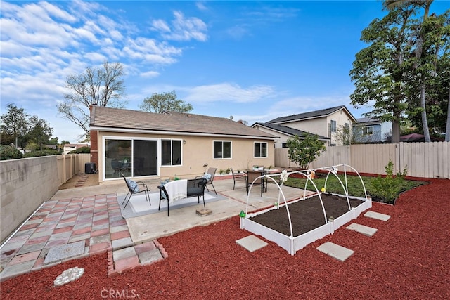 rear view of house featuring a patio