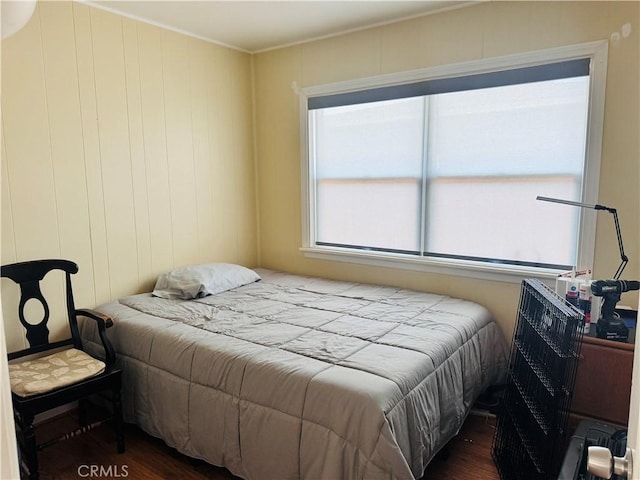 bedroom featuring dark hardwood / wood-style flooring