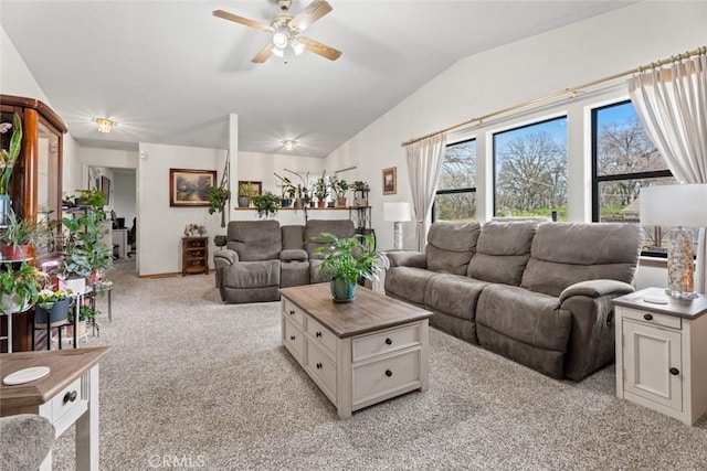 living room with vaulted ceiling, light carpet, and ceiling fan