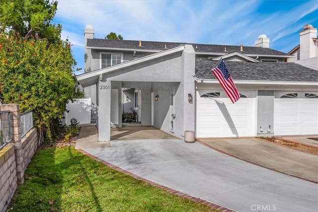 back of property with a garage