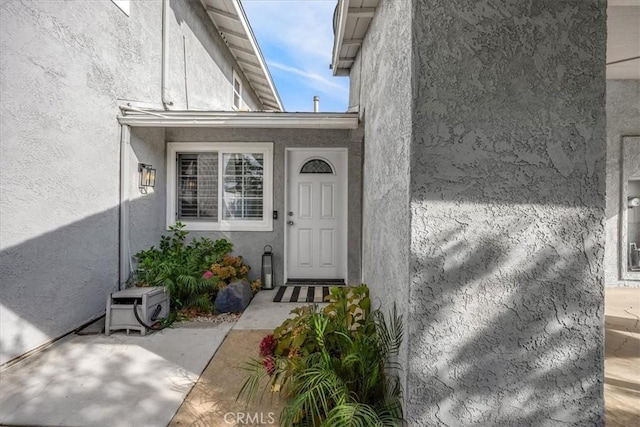 doorway to property featuring a patio