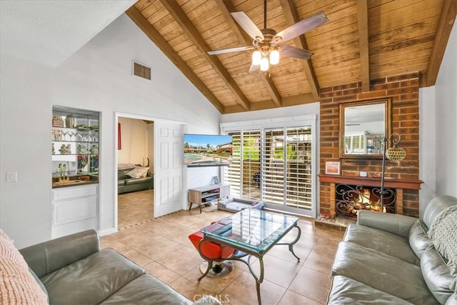 living room featuring sink, light tile patterned floors, wooden ceiling, and beam ceiling