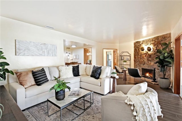 living room with a fireplace and hardwood / wood-style floors