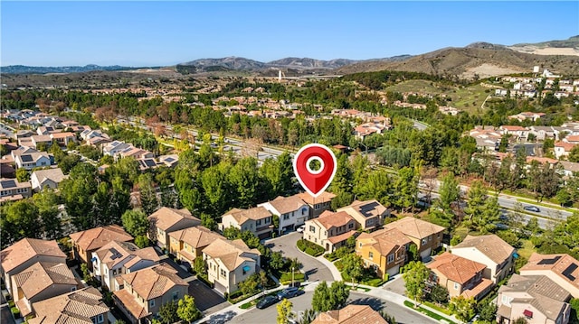 birds eye view of property with a residential view and a mountain view