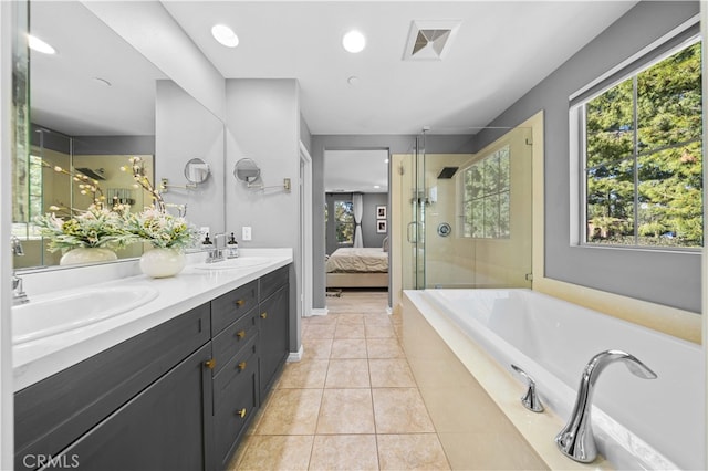 full bathroom featuring a stall shower, tile patterned flooring, a sink, and visible vents