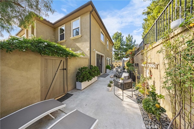 view of patio / terrace featuring fence