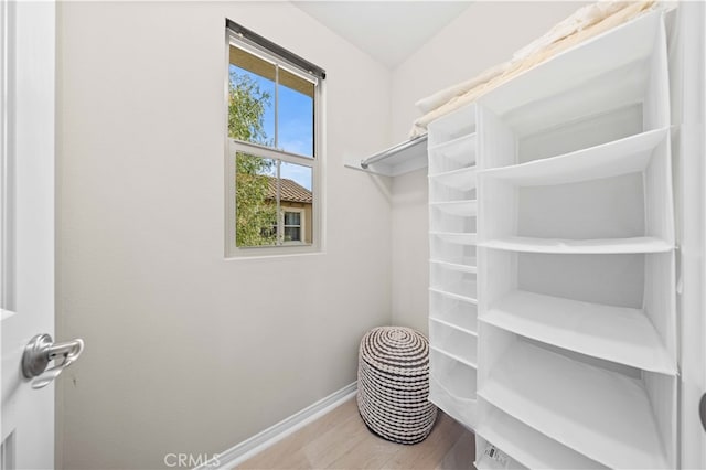 spacious closet with wood finished floors