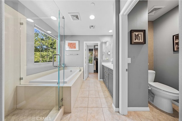 bathroom featuring toilet, a stall shower, visible vents, and vanity