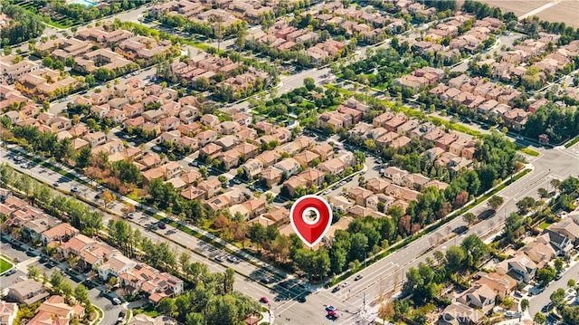 birds eye view of property with a residential view