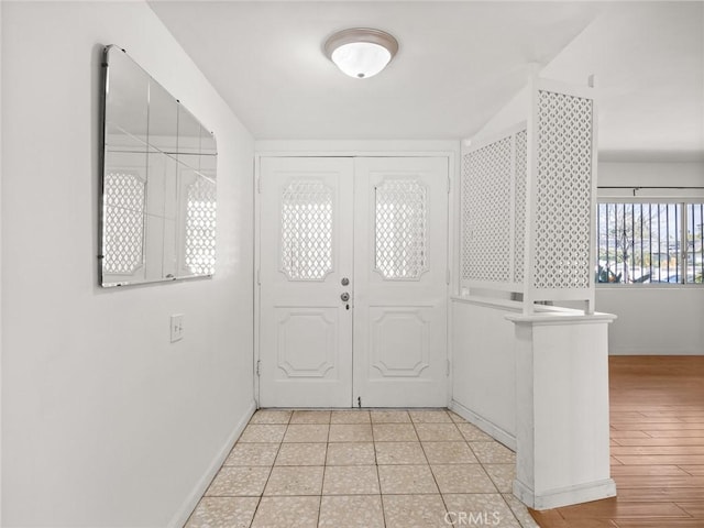 entryway featuring light tile patterned floors