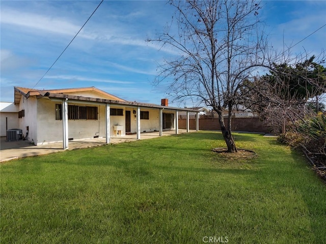 view of yard featuring central AC and a patio area