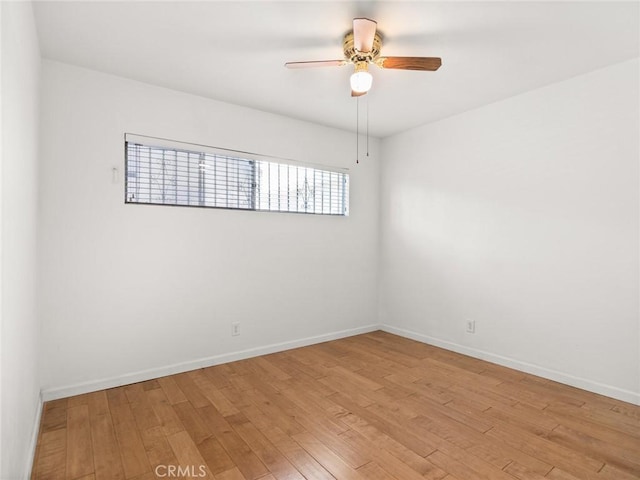 unfurnished room with ceiling fan and light wood-type flooring