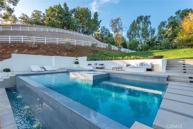 view of pool featuring an in ground hot tub