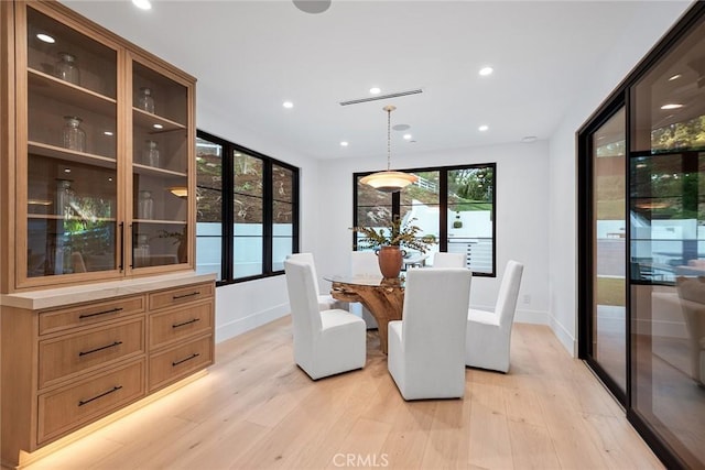 dining room with light hardwood / wood-style flooring