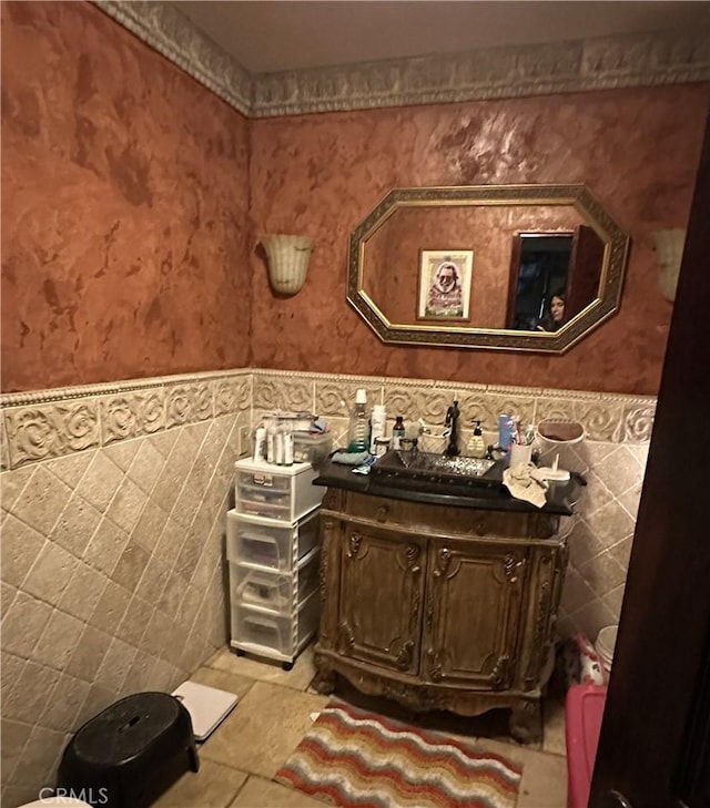 bathroom featuring vanity, tile walls, and tile patterned floors