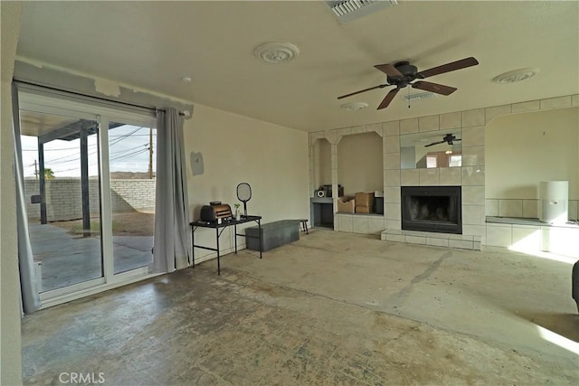 view of patio with ceiling fan, a fireplace, and visible vents