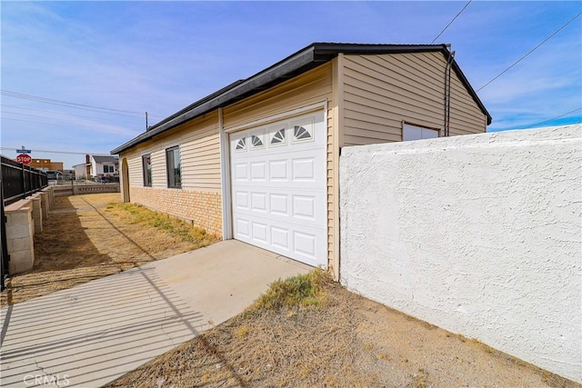 garage featuring fence