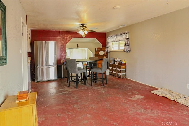 dining space with a ceiling fan