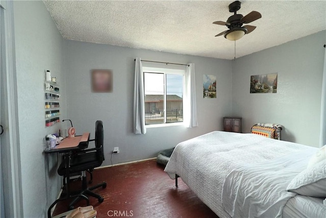 bedroom featuring a textured ceiling and ceiling fan