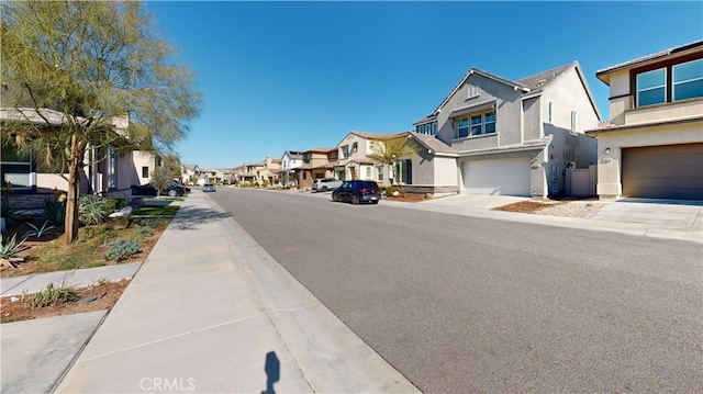 view of street with a residential view and sidewalks