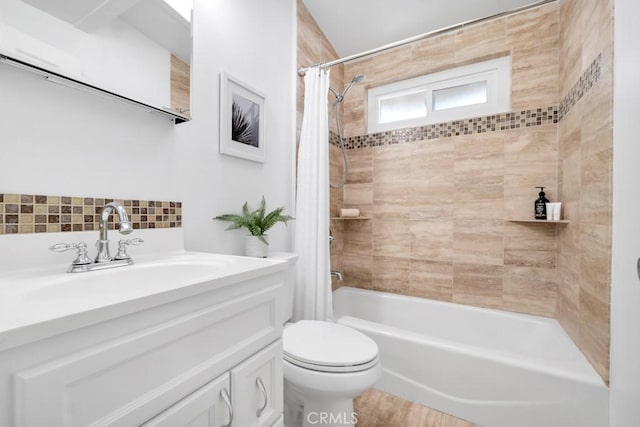 full bathroom with vanity, shower / bath combo, and toilet