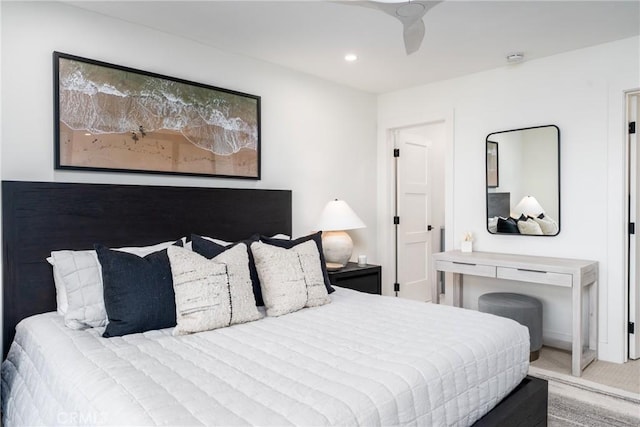 carpeted bedroom with ceiling fan