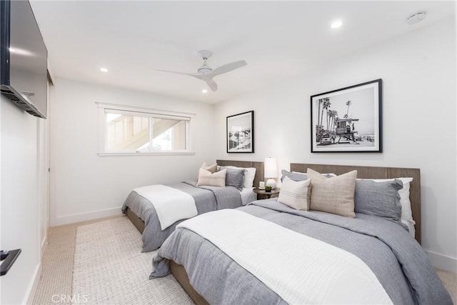 bedroom with light carpet and ceiling fan