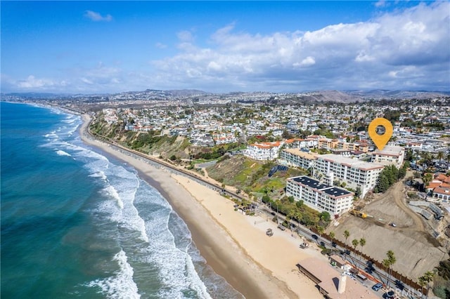 bird's eye view featuring a beach view and a water view