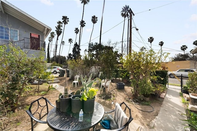 view of patio / terrace with outdoor dining space and fence