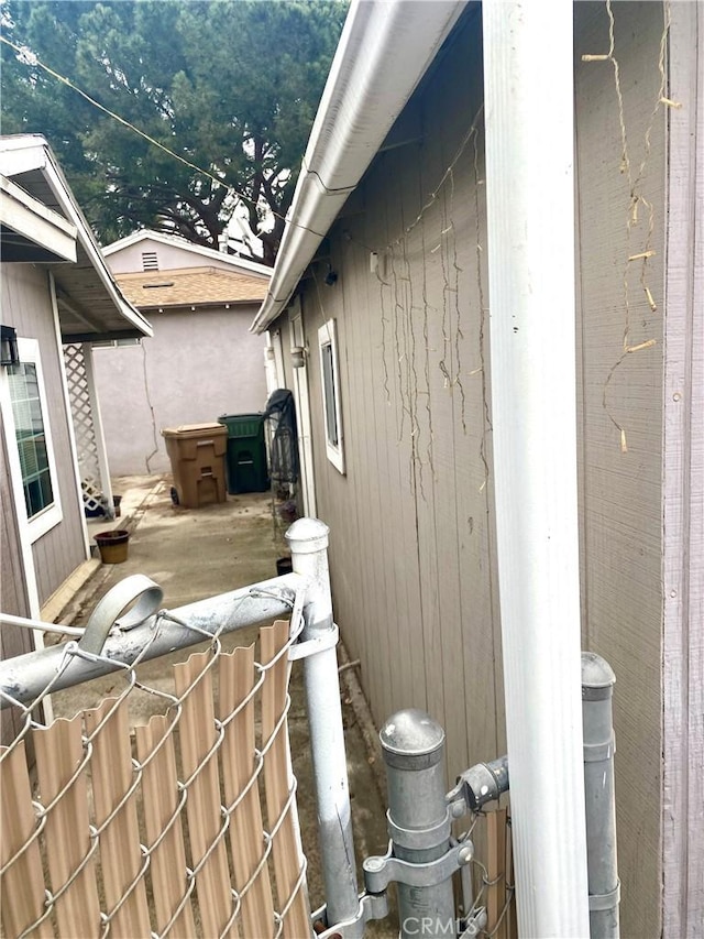 view of side of property with fence