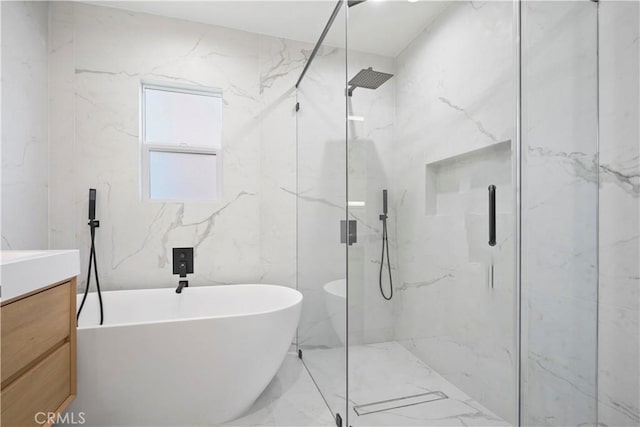 bathroom with vanity and independent shower and bath