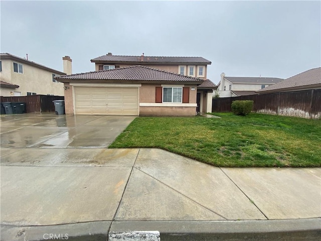 view of front facade featuring a garage and a front lawn