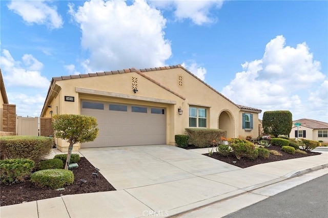 mediterranean / spanish house with a garage