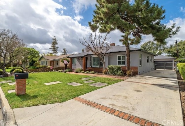 ranch-style home featuring a garage and a front lawn