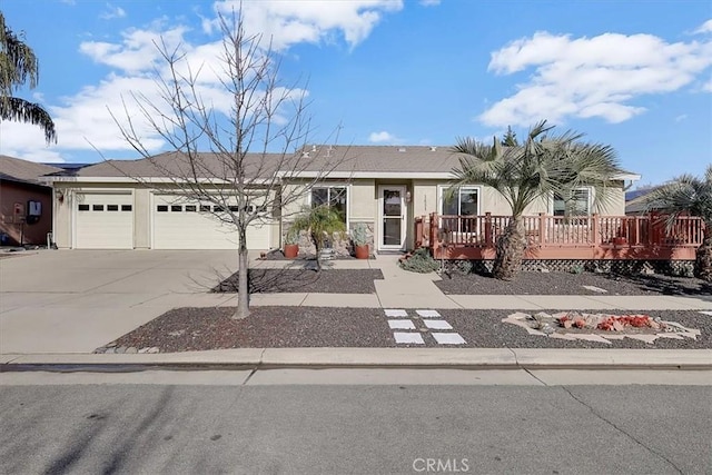 view of front of house featuring a garage and a deck