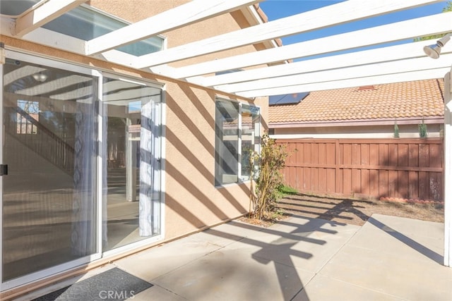 view of patio with fence and a pergola