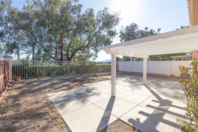 view of patio / terrace featuring a fenced backyard and a pergola